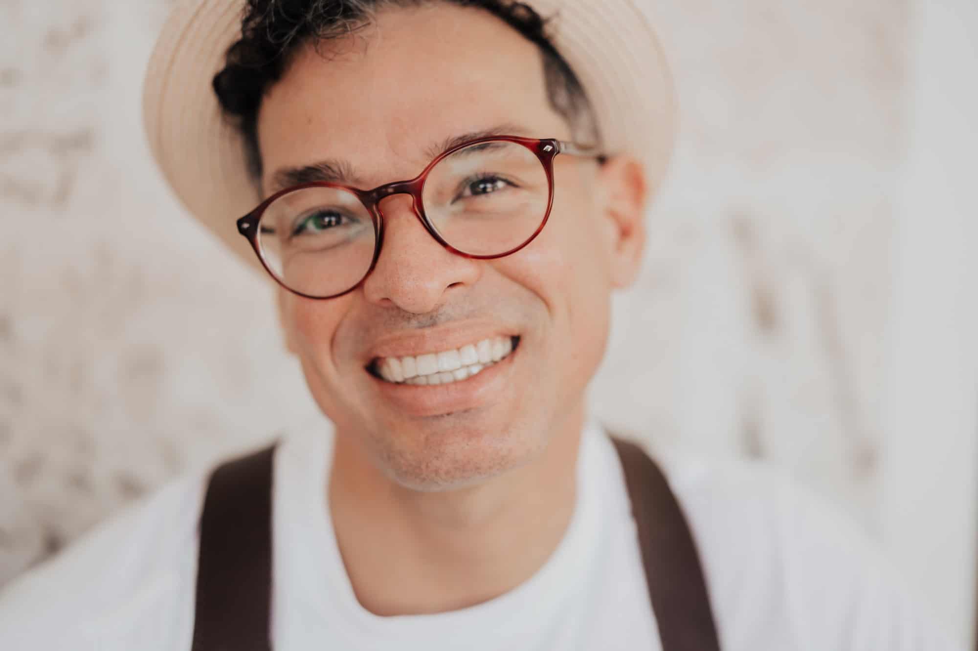 A portrait photo of a smiling man