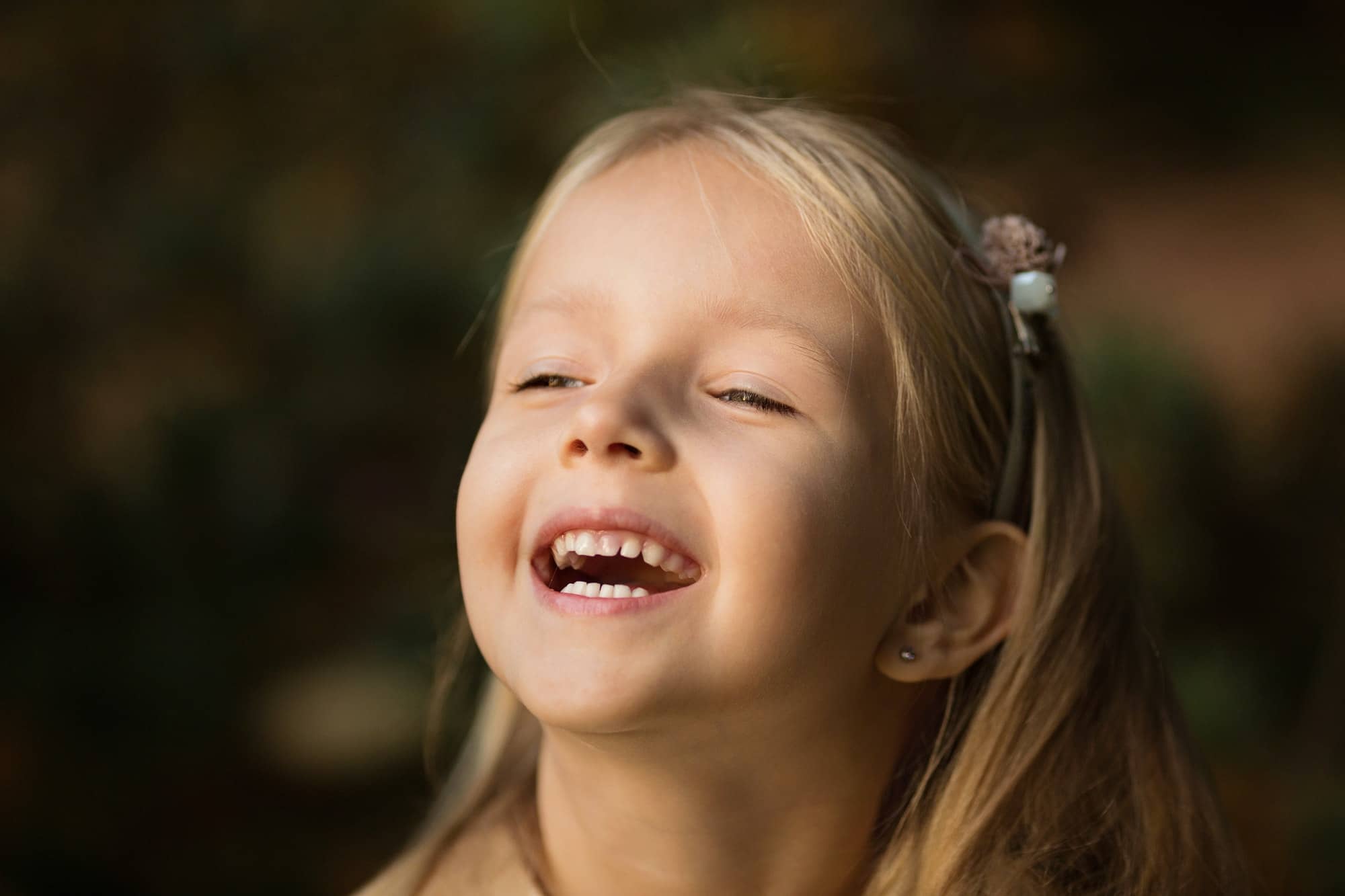Nominated Portrait of cute little girl with blonde hair outdoor happy kid laughing smile happiness